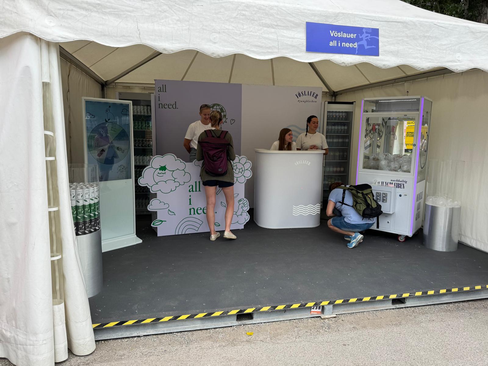 all i need activation stand with branded backdrop, drink fridges and a digital game terminal